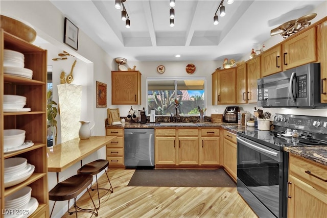 9237 Quail Ridge Dr, Las Vegas, NV 89134 - kitchen featuring range with electric stovetop, dishwasher, light wood-style flooring, track lighting, and dark stone countertops