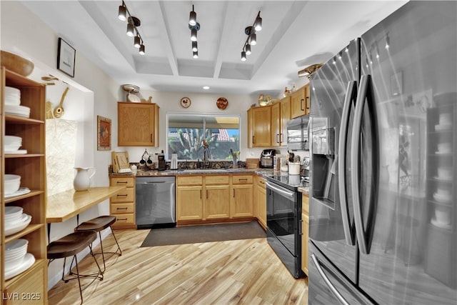 9237 Quail Ridge Dr, Las Vegas, NV 89134 - kitchen featuring appliances with stainless steel finishes, track lighting, and light wood-style floors