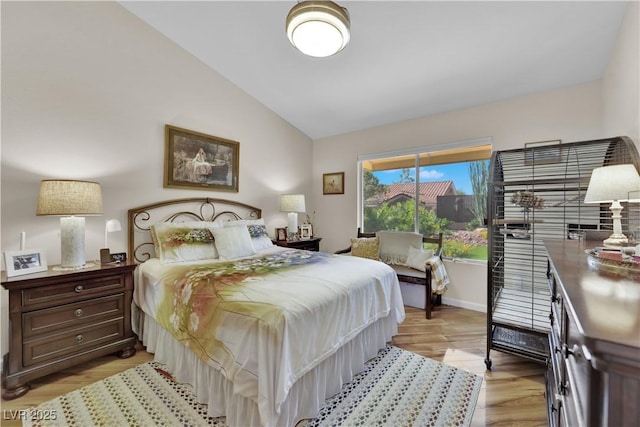 9237 Quail Ridge Dr, Las Vegas, NV 89134 - bedroom featuring vaulted ceiling and light wood finished floors