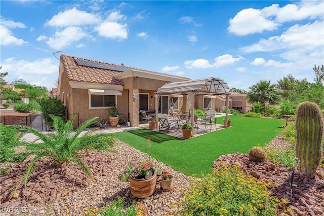 9237 Quail Ridge Dr, Las Vegas, NV 89134 - back of house featuring a tiled roof, solar panels, a patio area, a pergola, and stucco siding