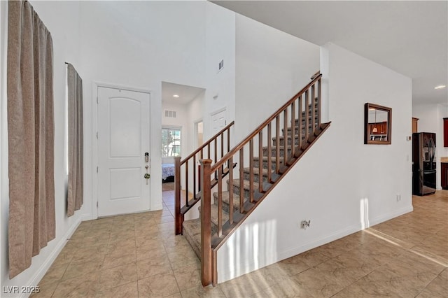 4641 Therapeutic St, North Las Vegas, NV 89031 - foyer featuring stairway, a towering ceiling, and recessed lighting
