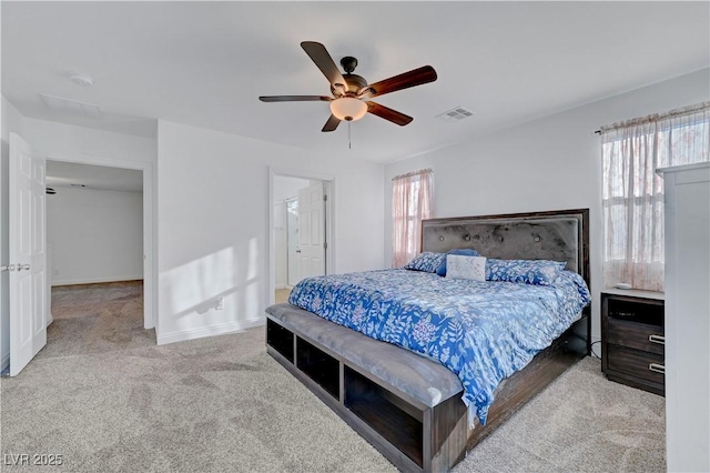 4641 Therapeutic St, North Las Vegas, NV 89031 - carpeted bedroom with baseboards and a ceiling fan