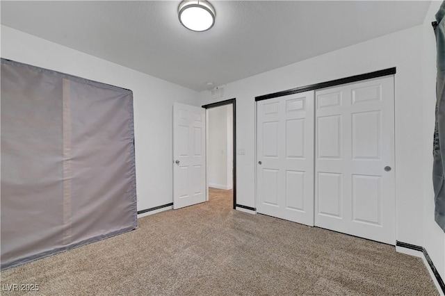 4641 Therapeutic St, North Las Vegas, NV 89031 - unfurnished bedroom featuring carpet flooring and a closet