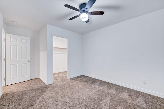 4641 Therapeutic St, North Las Vegas, NV 89031 - unfurnished bedroom with carpet floors, a spacious closet, a closet, and ceiling fan