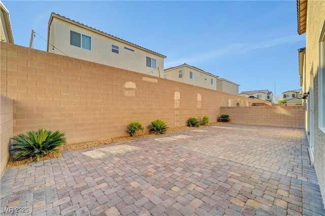 4641 Therapeutic St, North Las Vegas, NV 89031 - fenced backyard featuring a patio area