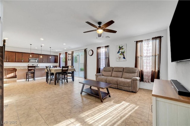 4641 Therapeutic St, North Las Vegas, NV 89031 - living area with ceiling fan, recessed lighting, and light tile patterned flooring