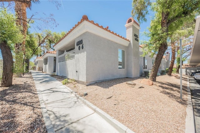 6006 Vegas Dr, Las Vegas, NV 89108 - view of property exterior with a tiled roof and stucco siding