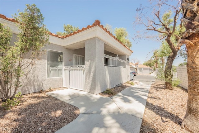 6006 Vegas Dr, Las Vegas, NV 89108 - view of home's exterior with stucco siding and a tile roof