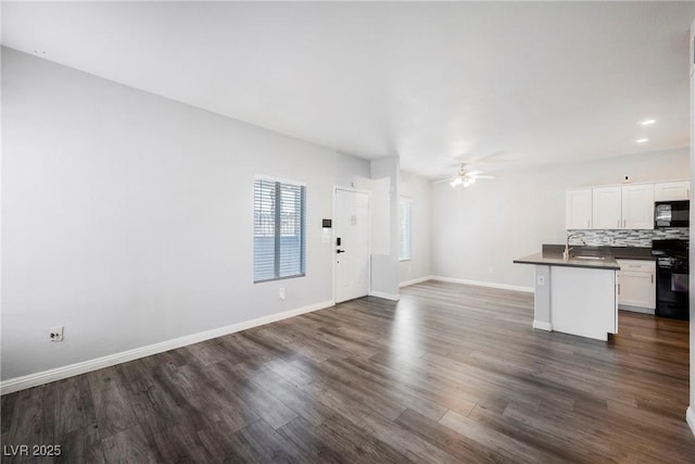 6006 Vegas Dr, Las Vegas, NV 89108 - unfurnished living room featuring a ceiling fan, dark wood-style floors, and recessed lighting
