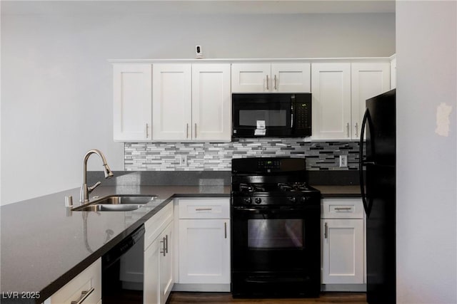 6006 Vegas Dr, Las Vegas, NV 89108 - kitchen featuring black appliances, white cabinets, and decorative backsplash