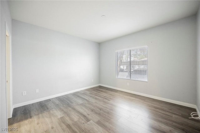 6006 Vegas Dr, Las Vegas, NV 89108 - unfurnished room with wood finished floors and baseboards