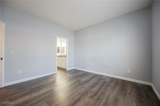 6006 Vegas Dr, Las Vegas, NV 89108 - empty room featuring baseboards and dark wood finished floors