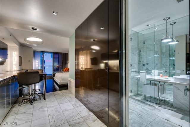 4381 Flamingo Rd Unit 2010, Las Vegas, NV 89103 - bathroom featuring marble look tiles, vanity, a shower stall, and a tub to relax in