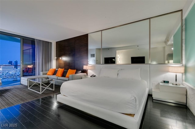 4381 Flamingo Rd Unit 2010, Las Vegas, NV 89103 - bedroom featuring floor to ceiling windows, wood finished floors, and access to outside