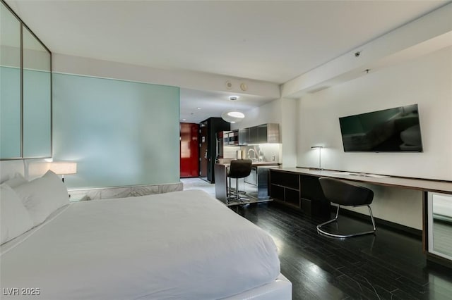 4381 Flamingo Rd Unit 2010, Las Vegas, NV 89103 - bedroom with dark wood-style floors and a sink