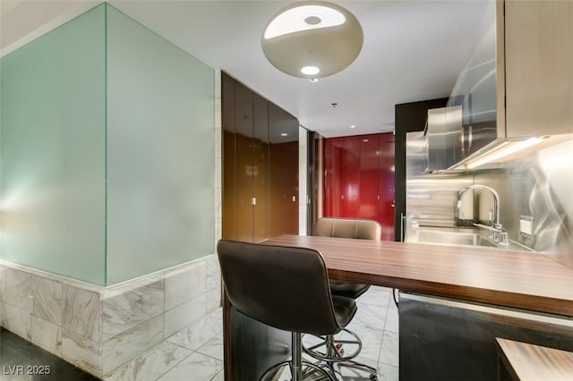 4381 Flamingo Rd Unit 2010, Las Vegas, NV 89103 - kitchen featuring a sink and light marble finish floors