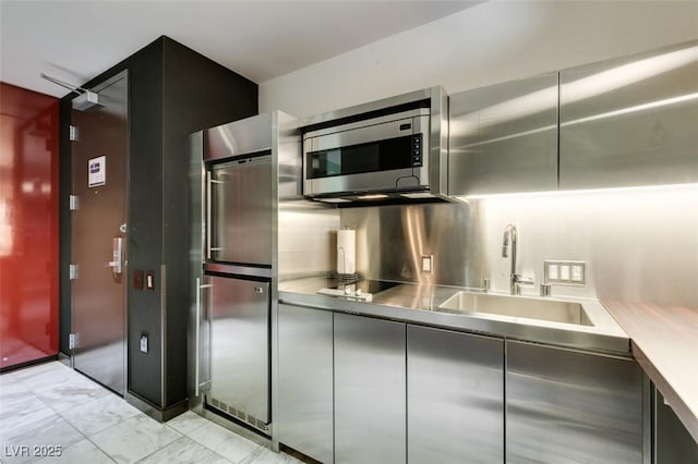 4381 Flamingo Rd Unit 2010, Las Vegas, NV 89103 - kitchen featuring stainless steel microwave, fridge, black electric cooktop, and modern cabinets