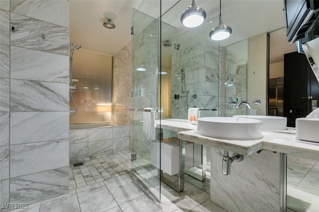4381 Flamingo Rd Unit 2010, Las Vegas, NV 89103 - bathroom with a shower stall, marble finish floors, and tile walls