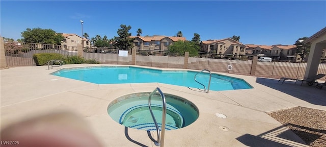 2050 N Los Feliz St Unit 170, Las Vegas, NV 89156 - community pool featuring a community hot tub, a residential view, and a patio