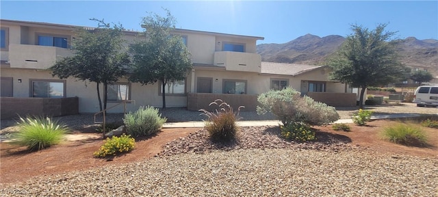 2050 N Los Feliz St Unit 170, Las Vegas, NV 89156 - back of house with stucco siding and a mountain view