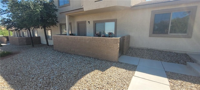 2050 N Los Feliz St Unit 170, Las Vegas, NV 89156 - view of property exterior featuring stucco siding and a fenced front yard