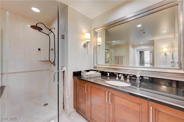 135 E Harmon Ave Unit 2721, Las Vegas, NV 89109 - bathroom with a shower stall, vanity, and recessed lighting