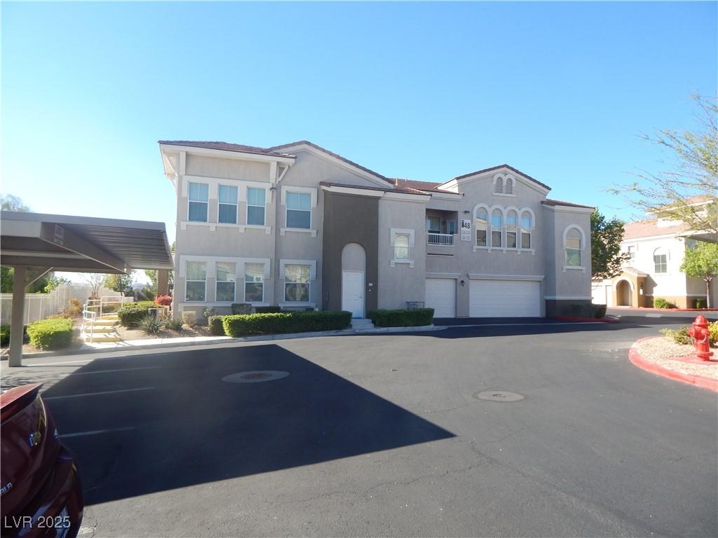 9975 Peace Way Unit 1149, Las Vegas, NV 89147 - view of front of house with stucco siding