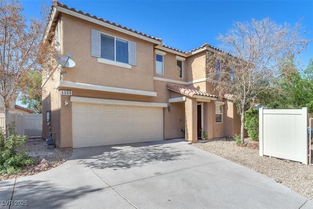 6068 Conroe Ct, Las Vegas, NV 89118 - view of front of property featuring a tile roof, stucco siding, a garage, and driveway