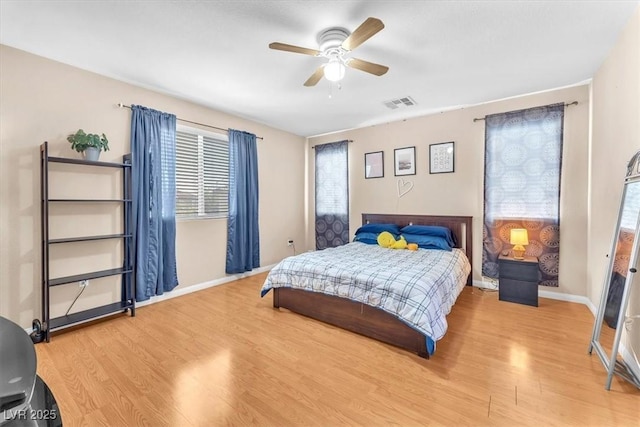 6068 Conroe Ct, Las Vegas, NV 89118 - bedroom featuring light wood-style flooring and a ceiling fan