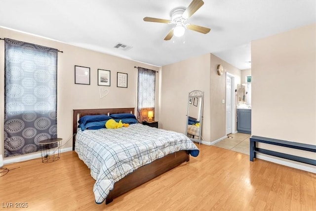 6068 Conroe Ct, Las Vegas, NV 89118 - bedroom with light wood finished floors and a ceiling fan