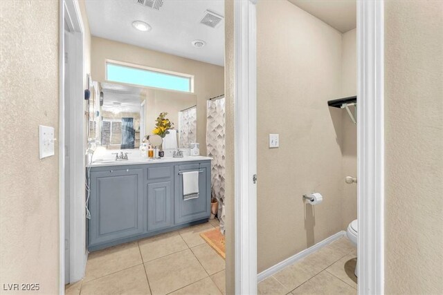 6068 Conroe Ct, Las Vegas, NV 89118 - full bathroom featuring double vanity, tile patterned flooring, and a shower with curtain