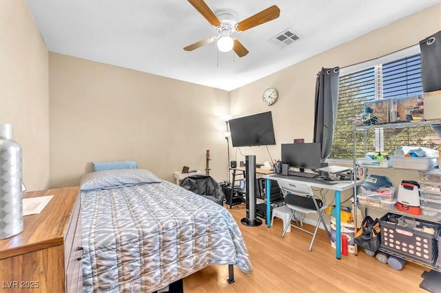 6068 Conroe Ct, Las Vegas, NV 89118 - bedroom featuring wood finished floors, an office area, and ceiling fan