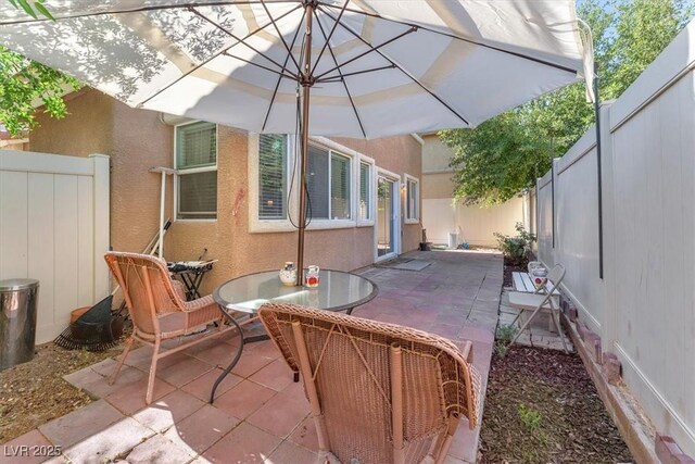 6068 Conroe Ct, Las Vegas, NV 89118 - fenced backyard with a patio area and outdoor dining area