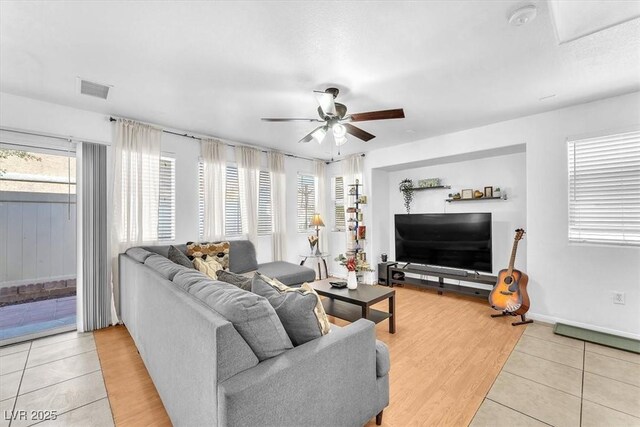 6068 Conroe Ct, Las Vegas, NV 89118 - living room with ceiling fan and light tile patterned flooring