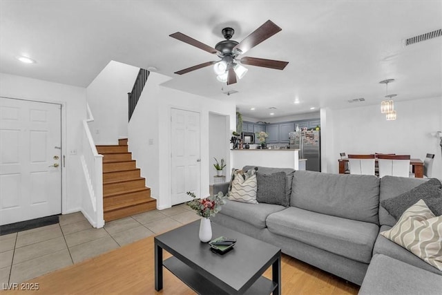 6068 Conroe Ct, Las Vegas, NV 89118 - living area with stairs, a ceiling fan, light tile patterned floors, and recessed lighting