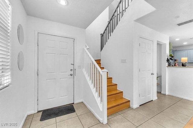 6068 Conroe Ct, Las Vegas, NV 89118 - entryway with light tile patterned floors, recessed lighting, and stairs