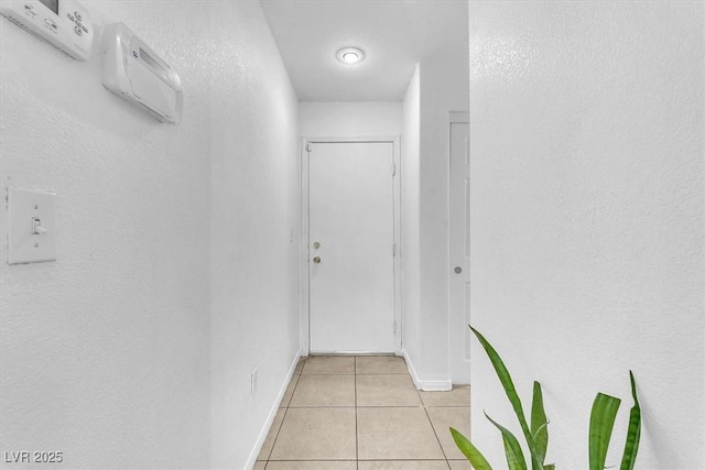 6068 Conroe Ct, Las Vegas, NV 89118 - corridor with light tile patterned flooring and baseboards