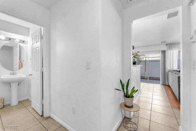 6068 Conroe Ct, Las Vegas, NV 89118 - hall with light tile patterned floors and baseboards