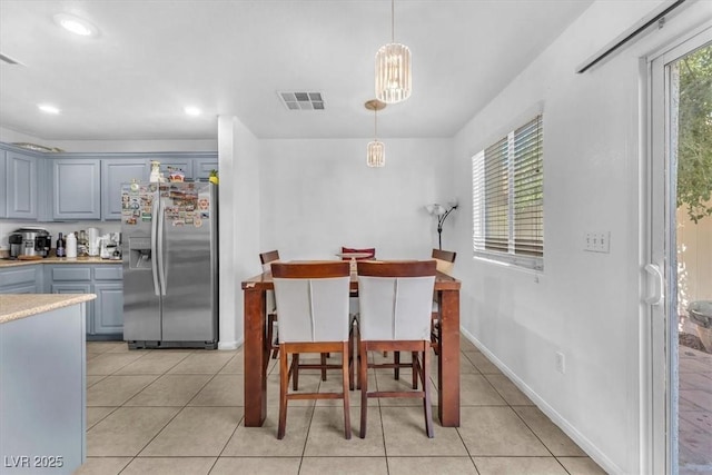 6068 Conroe Ct, Las Vegas, NV 89118 - dining space with light tile patterned floors and recessed lighting