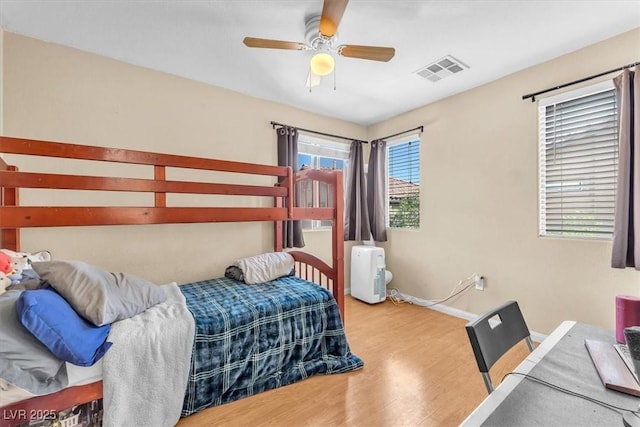 6068 Conroe Ct, Las Vegas, NV 89118 - bedroom with wood finished floors and ceiling fan