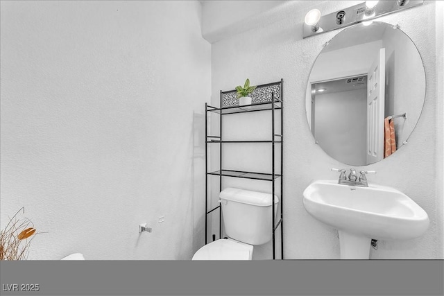 6068 Conroe Ct, Las Vegas, NV 89118 - bathroom featuring toilet and a sink