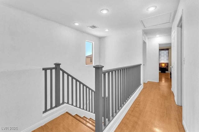 6068 Conroe Ct, Las Vegas, NV 89118 - corridor with an upstairs landing, wood finished floors, and recessed lighting