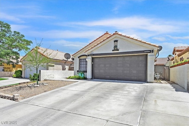 9151 Indian Breeze Dr, Las Vegas, NV 89129 - view of front facade featuring concrete driveway, stucco siding, an attached garage, and a tiled roof