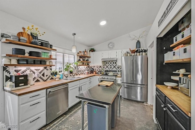 9151 Indian Breeze Dr, Las Vegas, NV 89129 - kitchen with high quality appliances, open shelves, wood counters, white cabinetry, and lofted ceiling