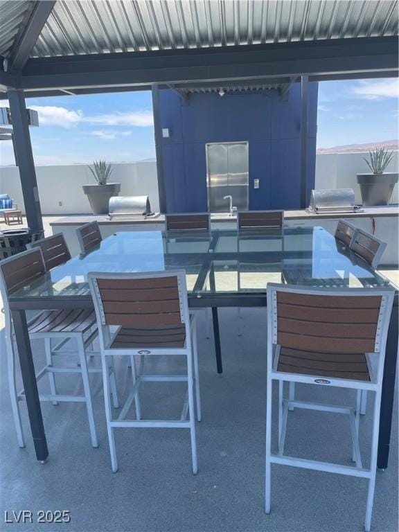 8925 W Flamingo Rd Unit 105, Las Vegas, NV 89147 - view of patio featuring outdoor dining space and grilling area