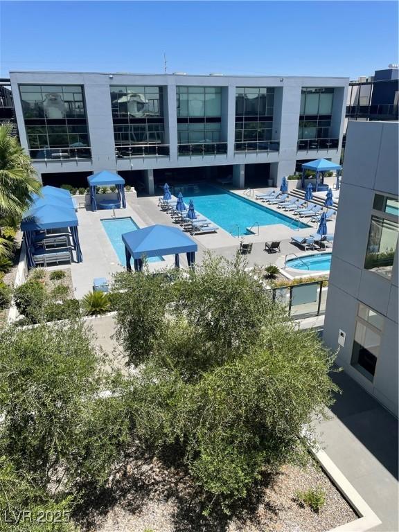 8925 W Flamingo Rd Unit 105, Las Vegas, NV 89147 - community pool with a patio area
