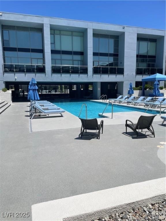 8925 W Flamingo Rd Unit 105, Las Vegas, NV 89147 - community pool featuring a patio