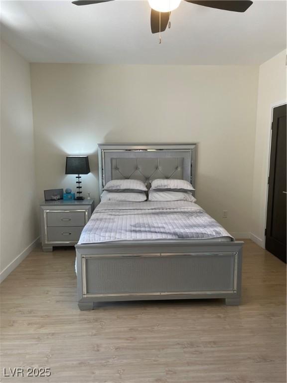 8925 W Flamingo Rd Unit 105, Las Vegas, NV 89147 - bedroom featuring light wood-style floors and ceiling fan