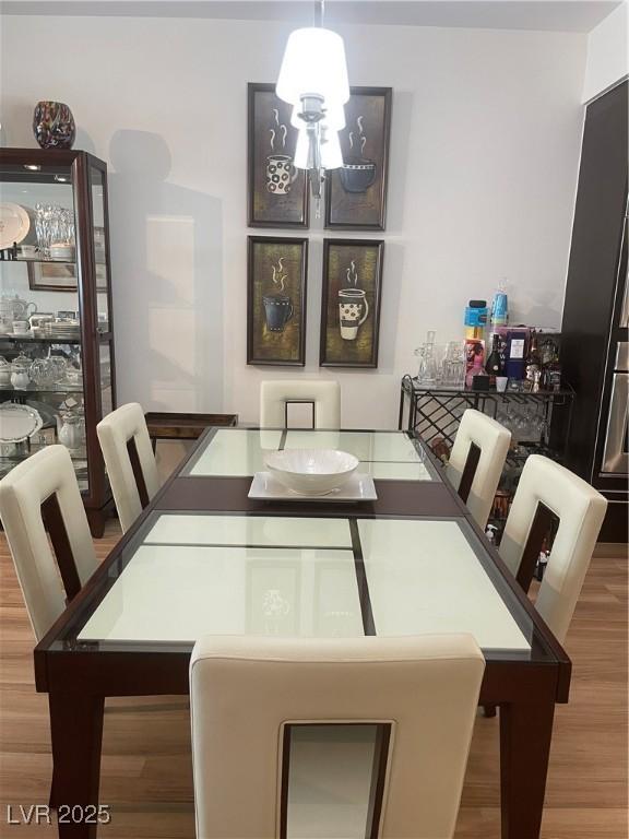 8925 W Flamingo Rd Unit 105, Las Vegas, NV 89147 - dining room with wood finished floors