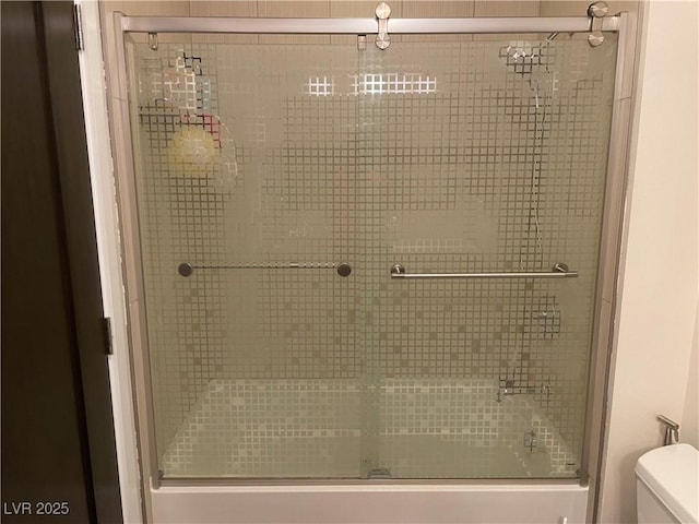 8925 W Flamingo Rd Unit 105, Las Vegas, NV 89147 - full bathroom with toilet and shower / bath combination with glass door